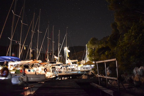 Sailing Yachts moored up in a Croatian port at night